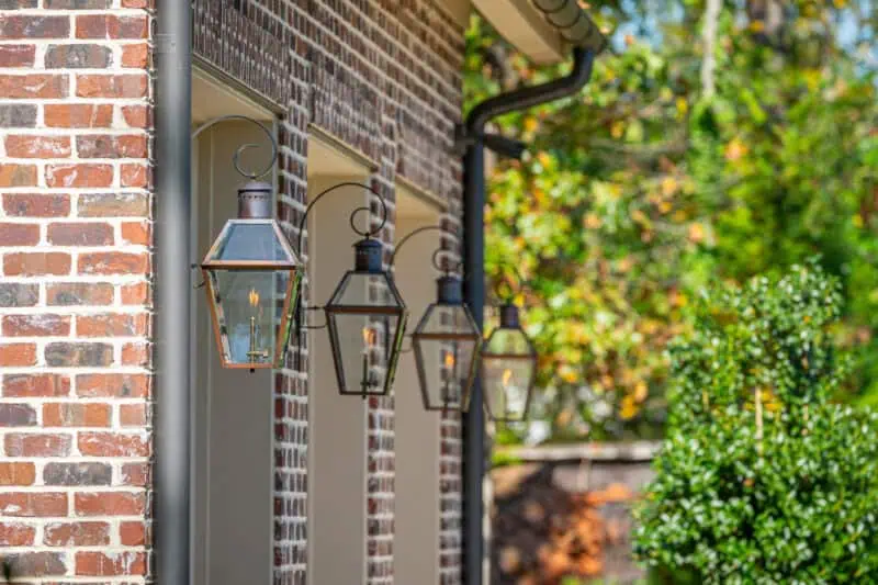 gas lantern details on exterior of red brick garage