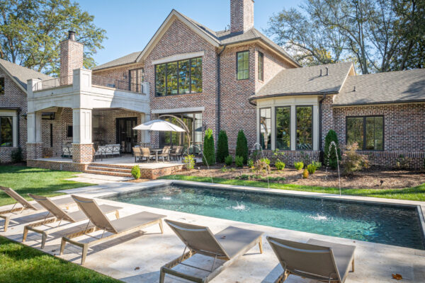 Porch pool and sun tanning chairs of Downtown Greenville Residence
