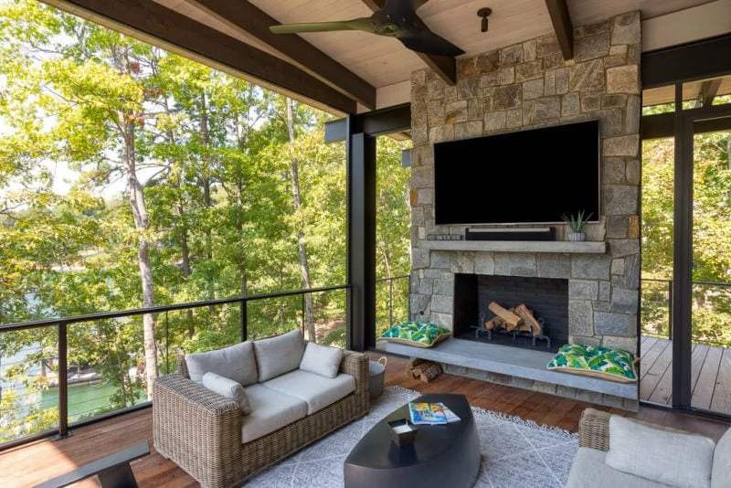 Outdoor sitting area with television and fireplace