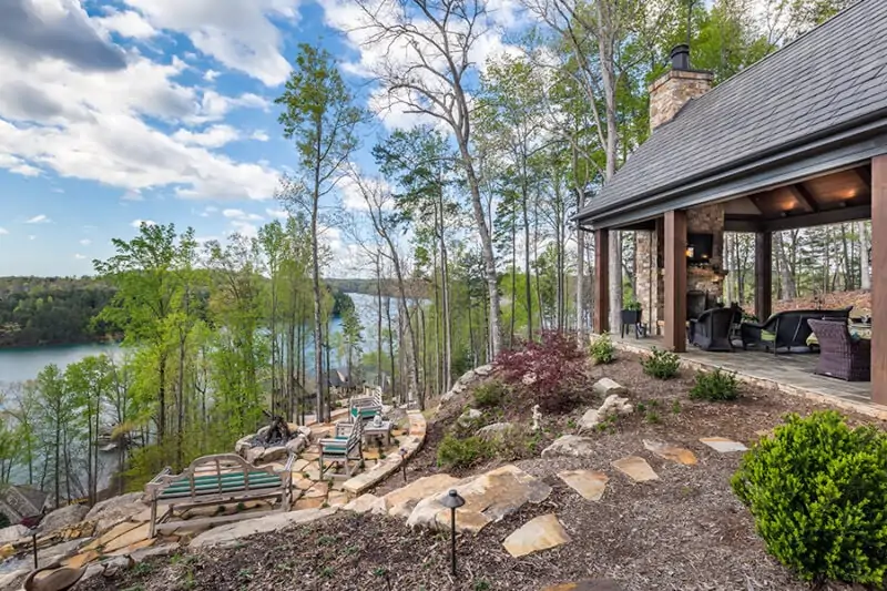 Outside Dining Table and TV Area with a View of Outside Fire Pit