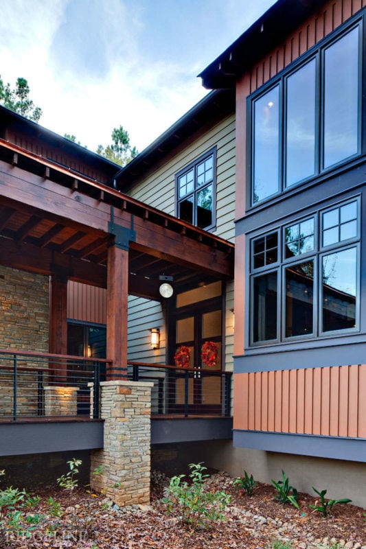 side view of covered walkway leading up to front doors