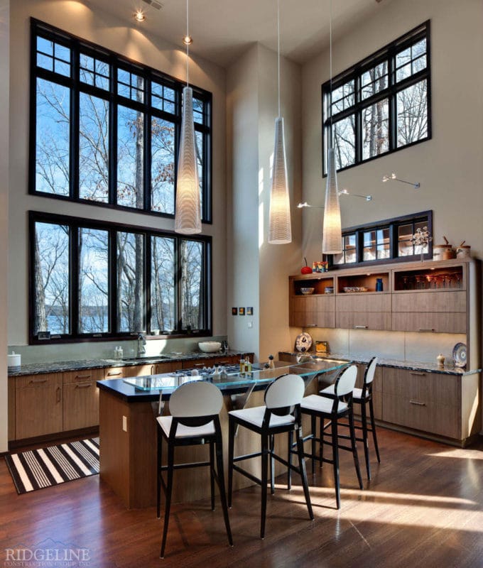 view of kitchen with windows to the ceiling and hanging light fixtures