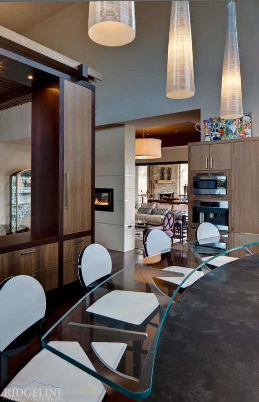 clear bar counter top with white bar stools underneath