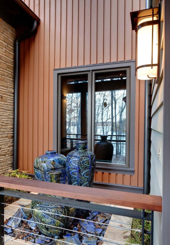 view of low window, partially covered with big vases