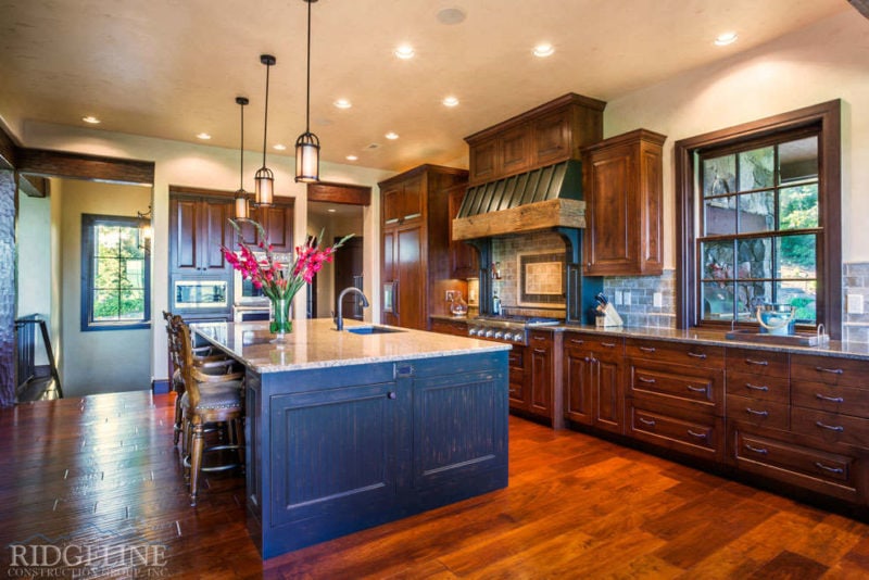 Beautiful kitchen with flowers on island