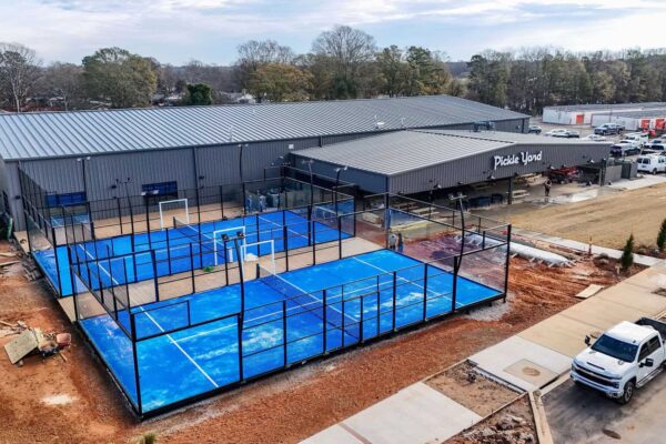 image of outdoor pickleball courts next to indoor pickleball facility