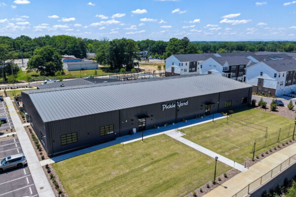 overhead view of pickleyard with outside volleyball grass court