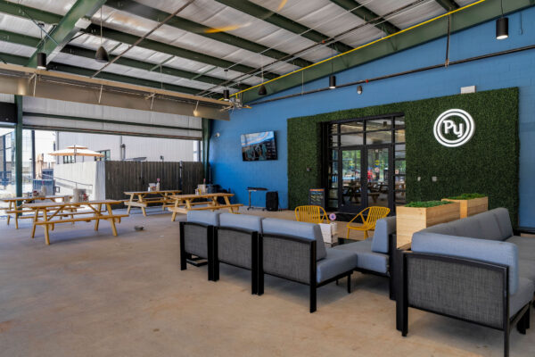 exterior covered lounge area at pickleyard with picnic seating