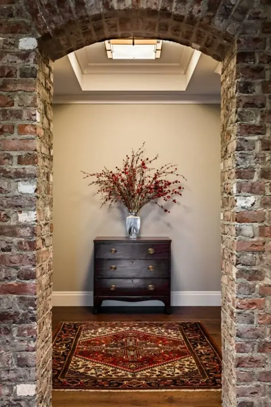 hallway with runner rug and dresser. rug style guide

