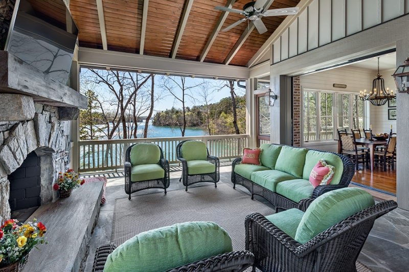 Covered patio with wicker furniture and television