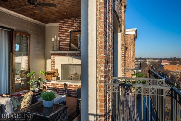 brick apartment with iron balcony railing