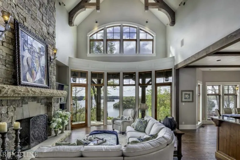 living room area with high ceilings and tall windows