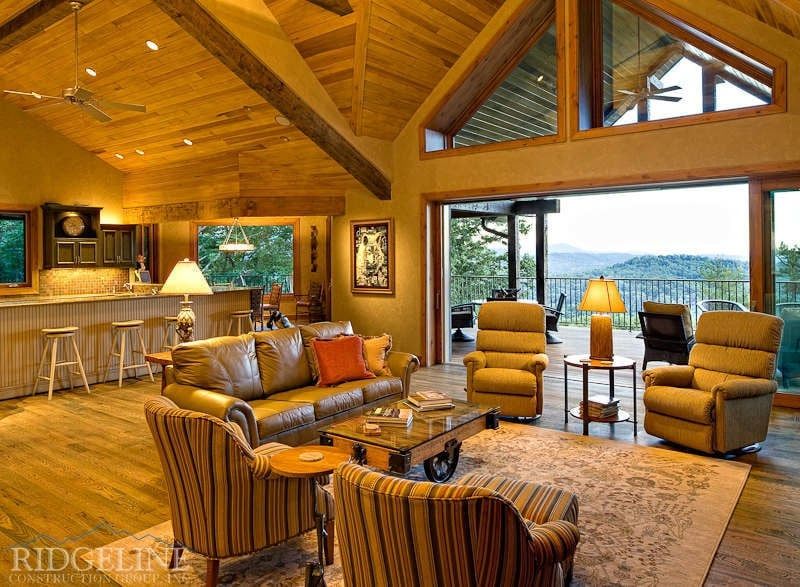 living room with high ceilings and large doors open to outdoor patio