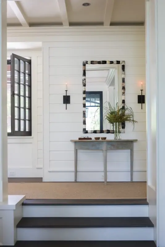 hallway with runner rug and entry table rug style guide

