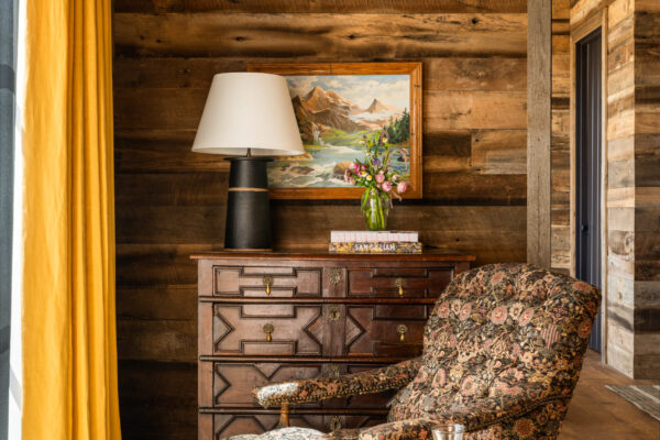 chair facing window in cabin home