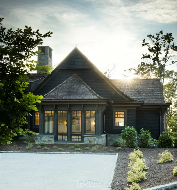 the cliffs mansion with sun going down behind it