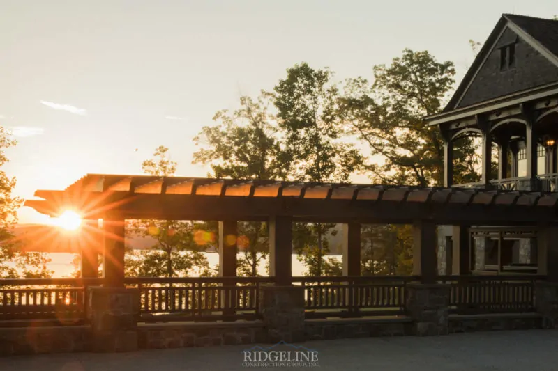 the cliffs mansion overlooking lake at sunset