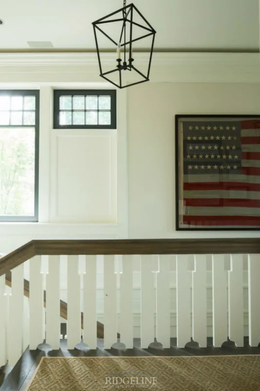 top of staircase with american flag on wall