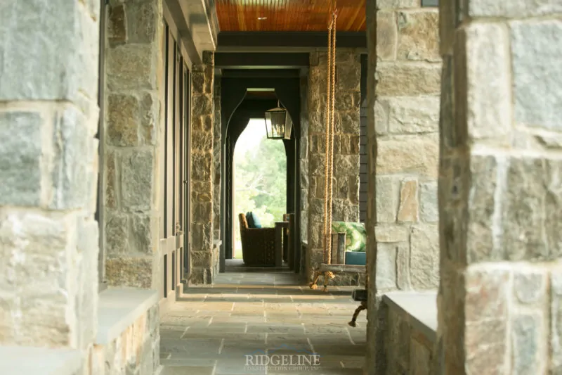 outdoor pathway with swinging char and outdoor furniture