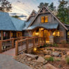 entry of mountain home with wooden bridge