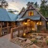 entry of mountain home with wooden bridge