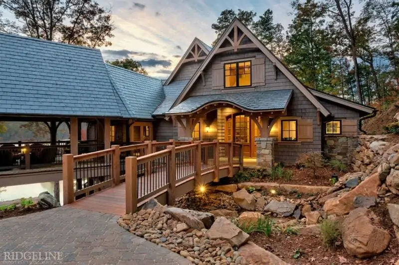 entry of mountain home with wooden bridge