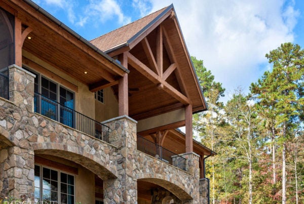 balcony of stone home with wooden detail