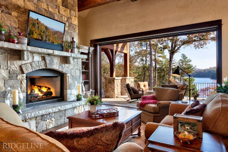 living room opening to outdoor patio and lake