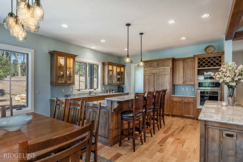 brown kitchen with marble countertops