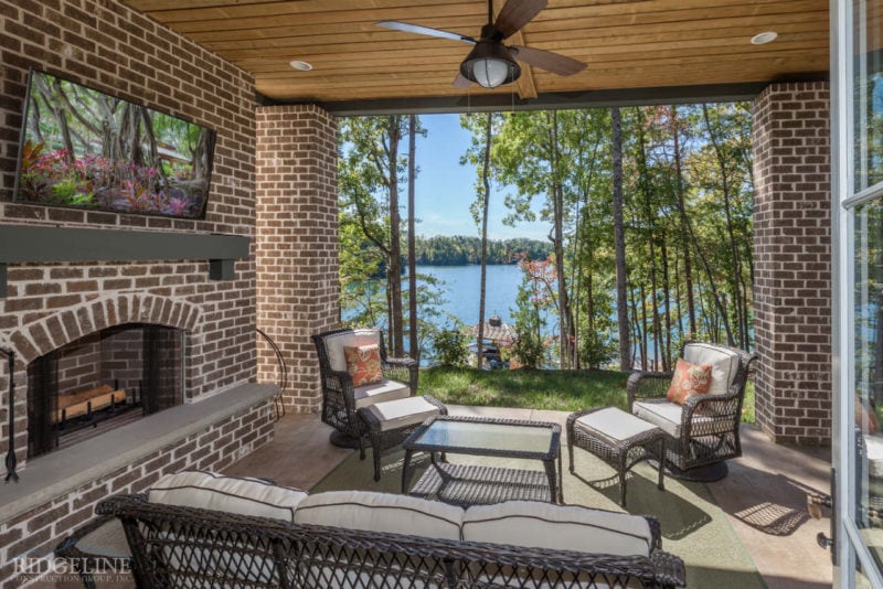 Outdoor patio with seating overlooking the lake