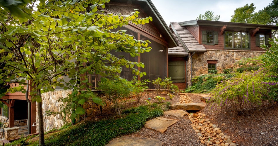 backyard of mountain home with stone accents
