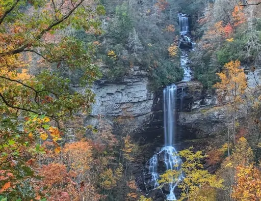 waterfall in south carolina mountain with fall foliage surrounding