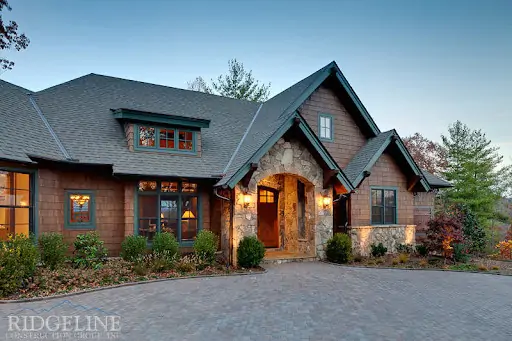 front of mountain home with stone facade